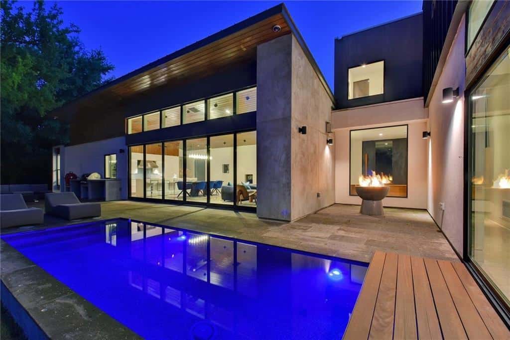 Modern Industrial Home with Soaring Shed Ceiling and Multi-Slide Glass Walls