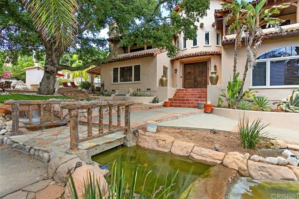 Moonlight Hacienda with Thick Adobe Archways, Distressed Beamed Ceilings, and Saltillo Pavers