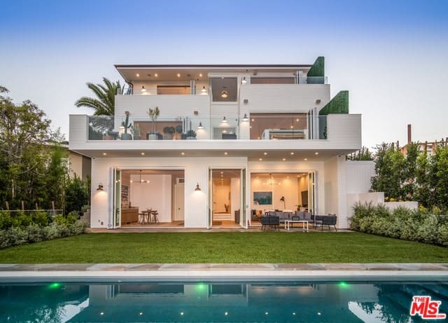 Beach Chic Farmhouse Home with Great Ceiling Heights, an Open Layout, and Multiple Outdoor Patios