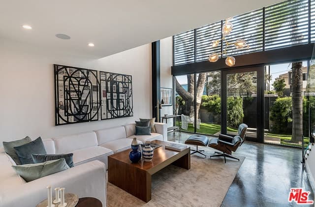 Gated Oasis with Huge Museum-Style Walls, Exposed Steel Beams, and Oversized Windows
