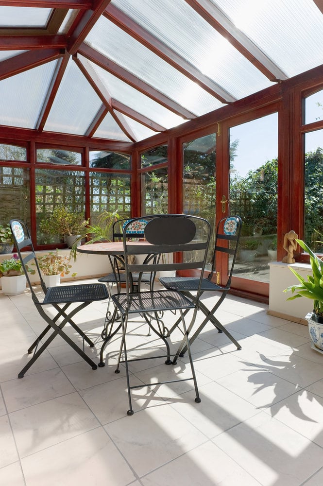 A contemporary type of sunroom located near the garden for that fresh environment.
